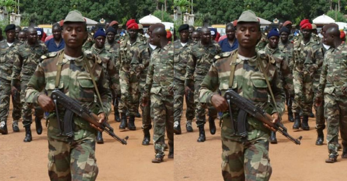 Guinean Soldiers Erect Pillar in Yenga